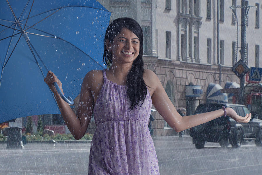 Woman having fun in the rain #1 Photograph by Abhinandita Mathur 