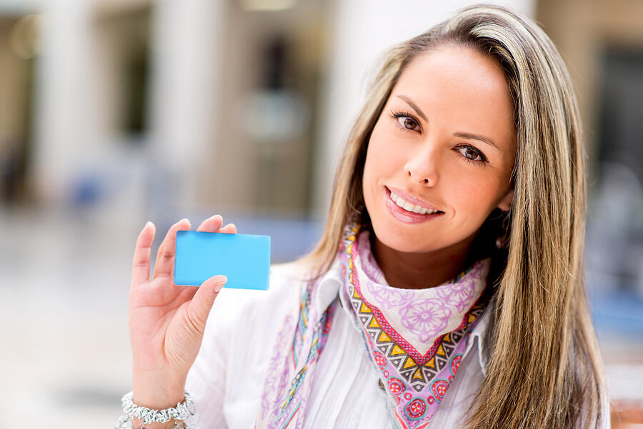 Woman holding a credit card #1 Photograph by Andresr