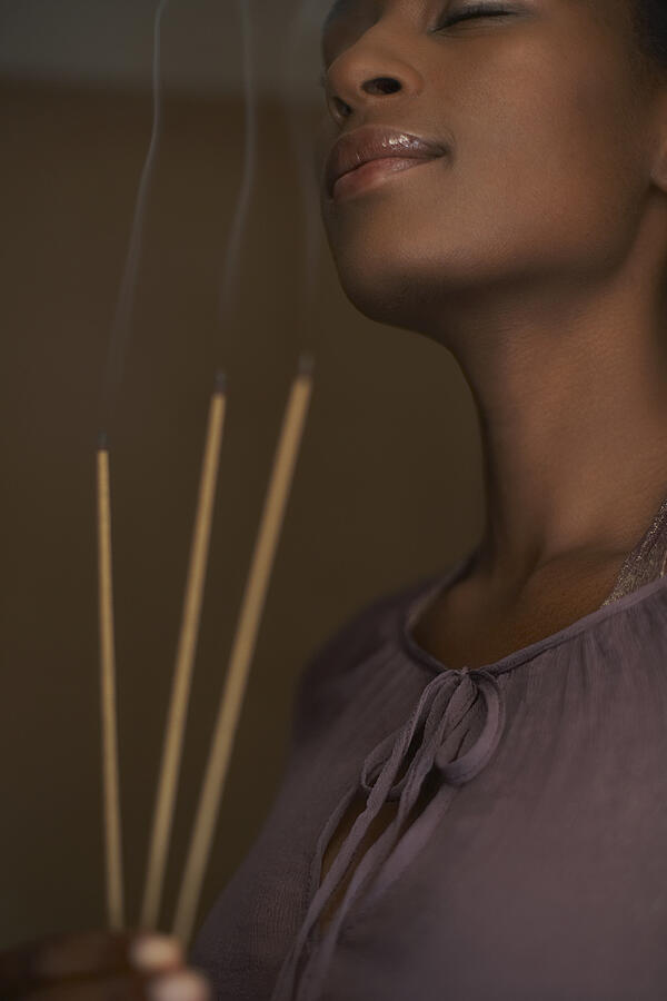 Woman holding three sticks of incense #1 Photograph by Felix Wirth