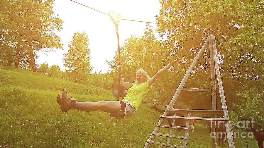 Woman playing with Zipline in Switzerland #1 Photograph by Benny Marty