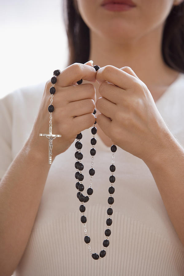 Woman praying with rosary beads #1 Photograph by Jose Luis Pelaez Inc