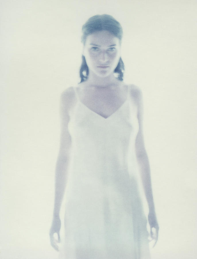 Woman standing, blurred. #1 Photograph by Matthieu Spohn