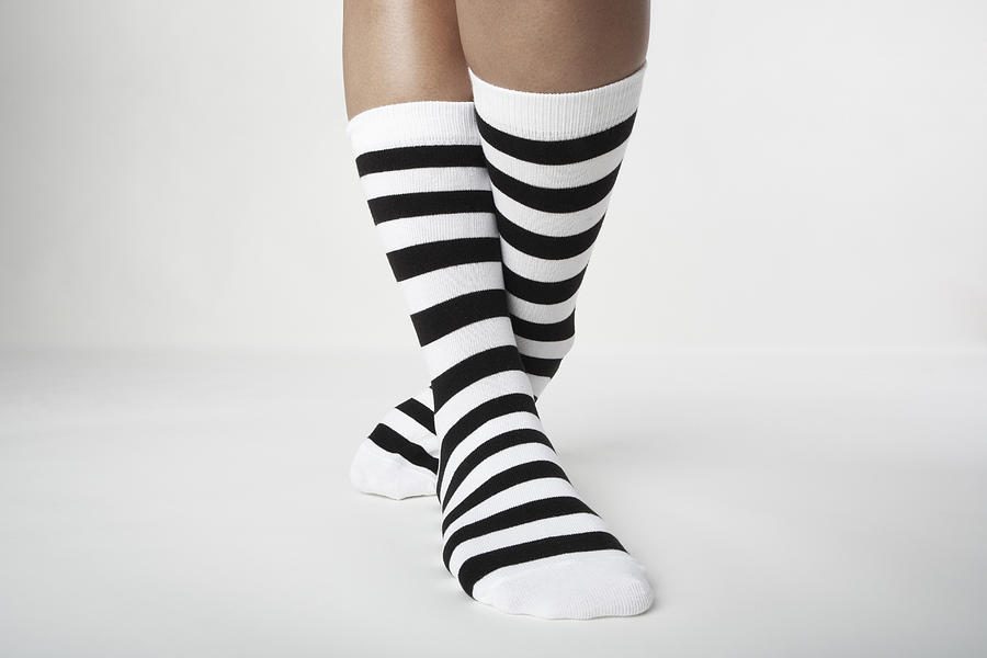 Woman wearing Striped socks. #1 Photograph by Ballyscanlon