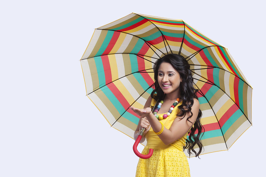 Woman with umbrella feeling for rain #1 Photograph by Sudipta Halder