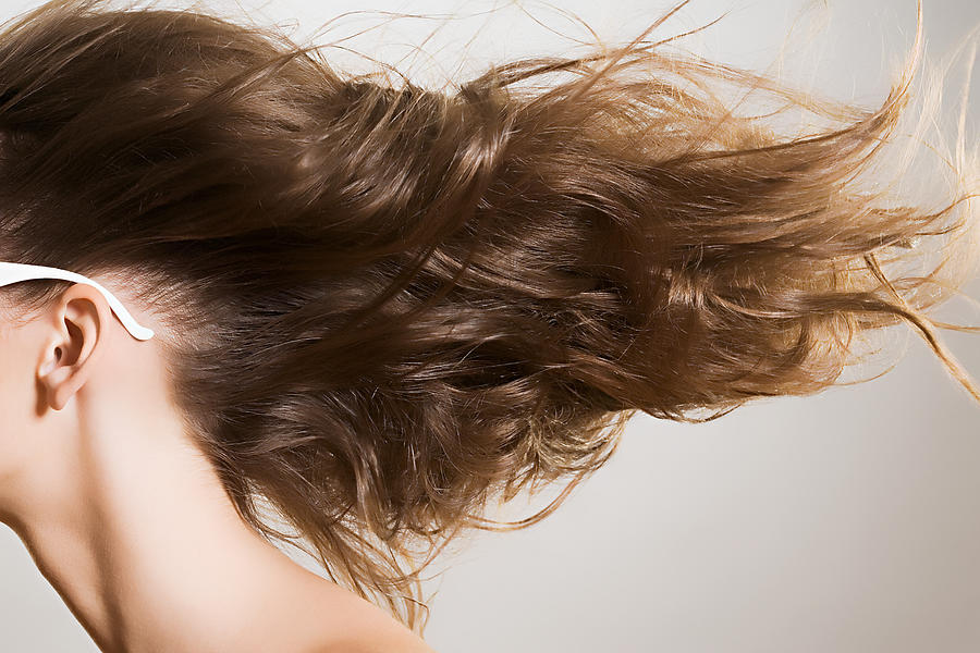 Woman with windswept hair #1 Photograph by Image Source