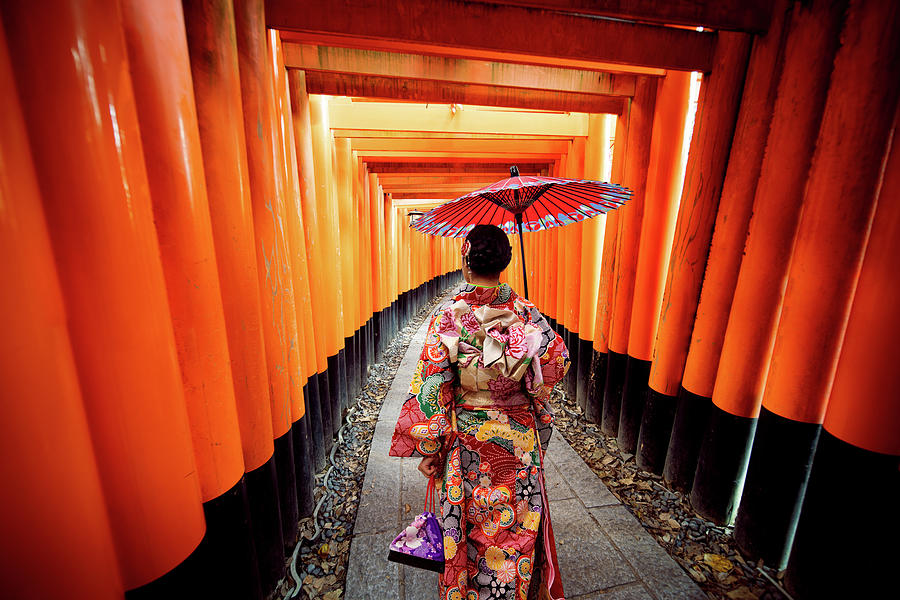 Women in traditional japanese kimonos walking at Fushimi Inari S ...