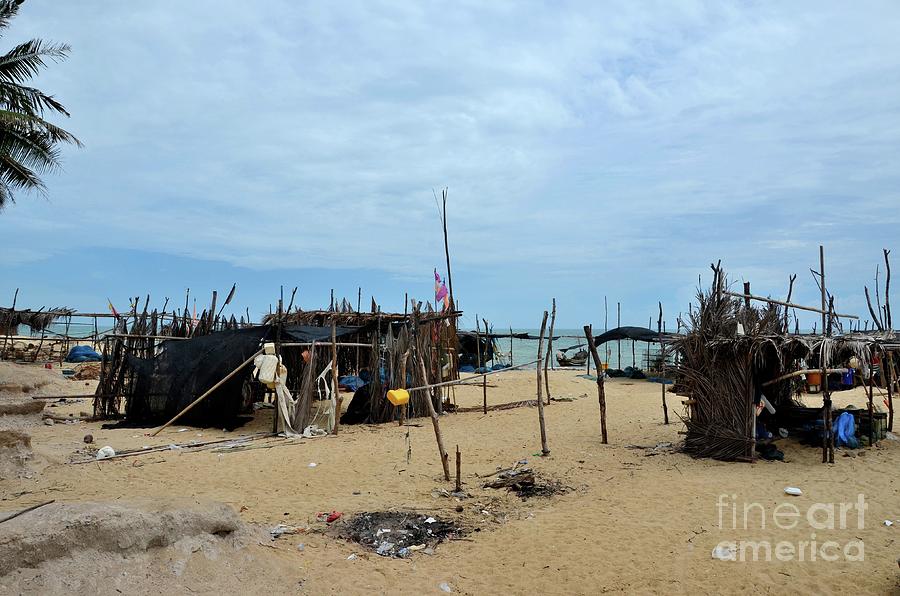 Fish Photograph - Wood and bamboo palm leaf thatched shacks by seaside in fishing village Pattani Thailand  #2 by Imran Ahmed