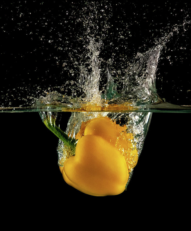 Yellow bell pepper dropped and slashing on water #2 Photograph by Michalakis Ppalis