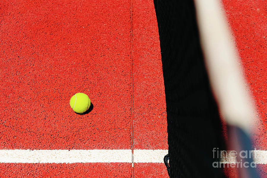 Yellow Tennis Ball On The Red Cement Court To The Sun, Summer Sp Photograph