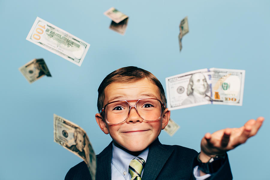 Young Boy Accountant Wearing Glasses with Falling Money #1 Photograph by RichVintage