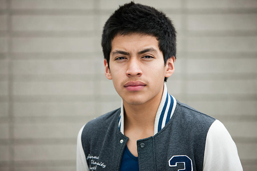 Young man wearing baseball jacket, portrait #1 Photograph by Image Source