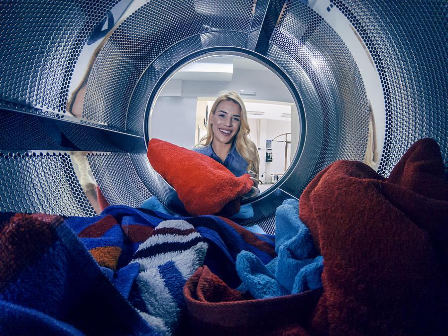 Young woman having a laundry day #1 Photograph by Bluecinema