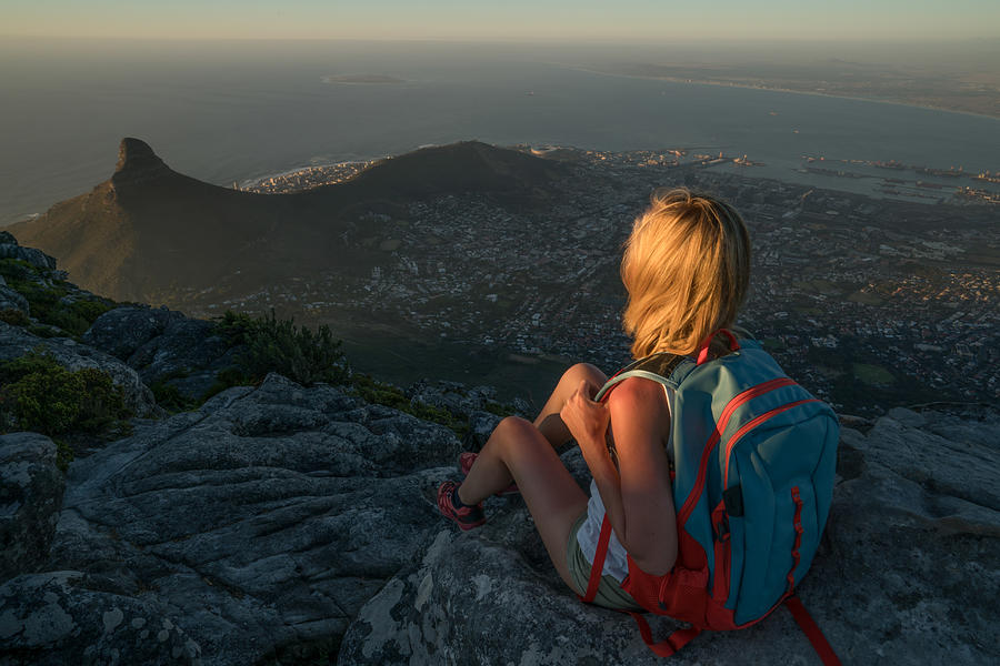 Young woman in Cape Town on top of mountain looking at view #1 Photograph by Swissmediavision
