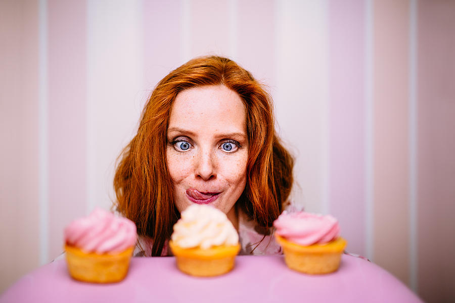 Young Woman Really Wants To Eat Cupcakes #1 Photograph by Wundervisuals