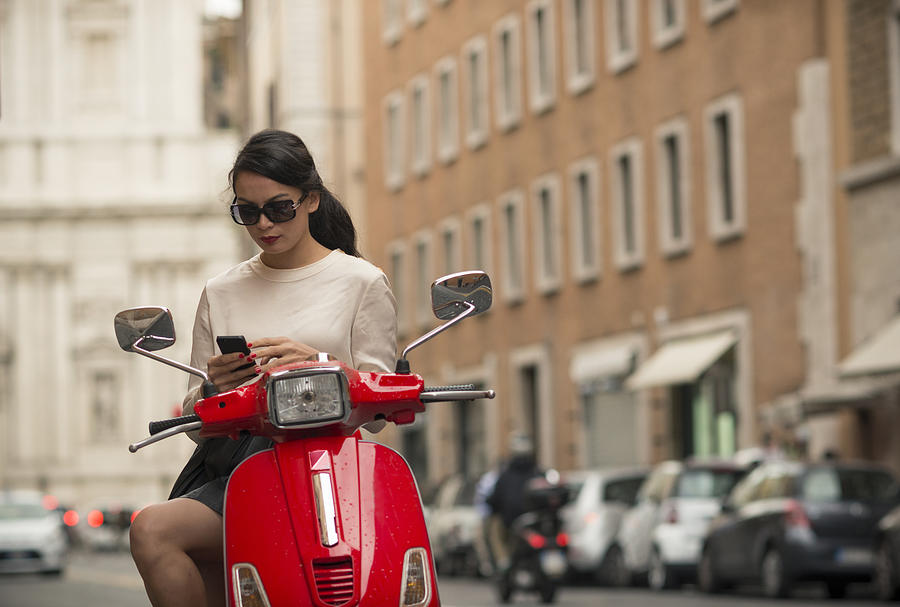 Young woman waiting by moped, Piazza del Popolo, Rome, Italy #1 Photograph by Cultura RM Exclusive/Ben Pipe Photography