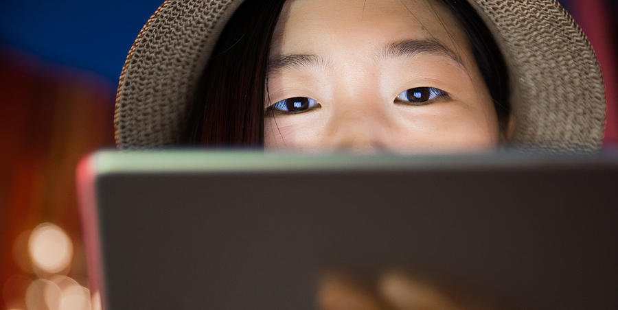 Young Women Looking At Digital Tablet #1 Photograph by Xijian