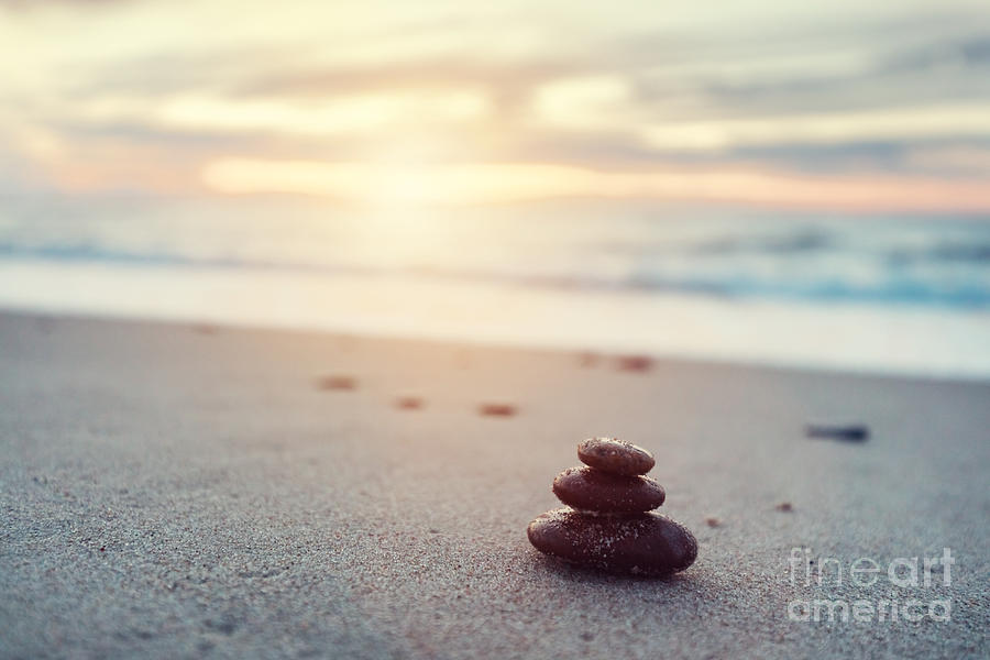 Zen stones on calm beach at sunset #1 Photograph by Michal Bednarek