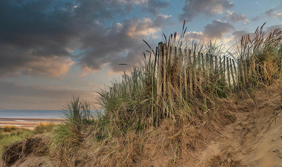 Beautiful sunrise over sand dunes system on yellow sand golden b ...