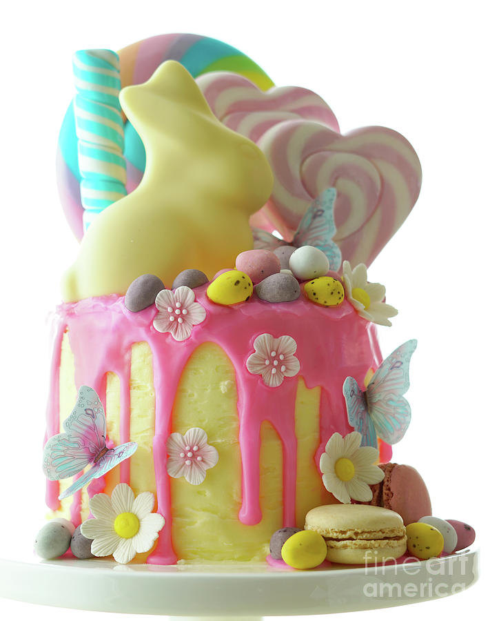Easter candy land drip cake decorated with lollipops and white bunny. #10 Photograph by Milleflore Images