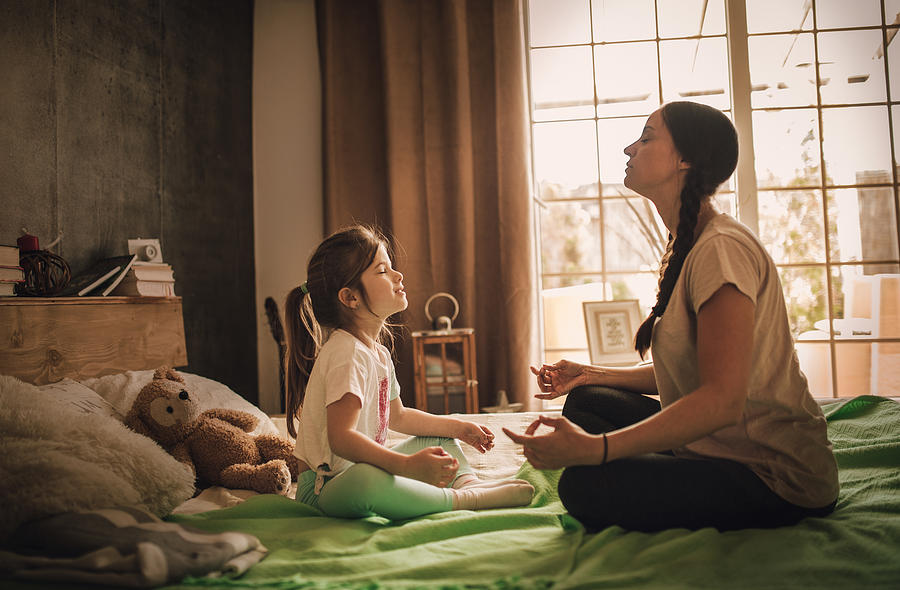 Mother and daughter practicing  in bedroom #10 Photograph by Zeljkosantrac