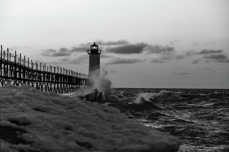 Sunset at Manistee Pier and Lighthouse in Manistee Michigan during the winter #10 Photograph by Eldon McGraw