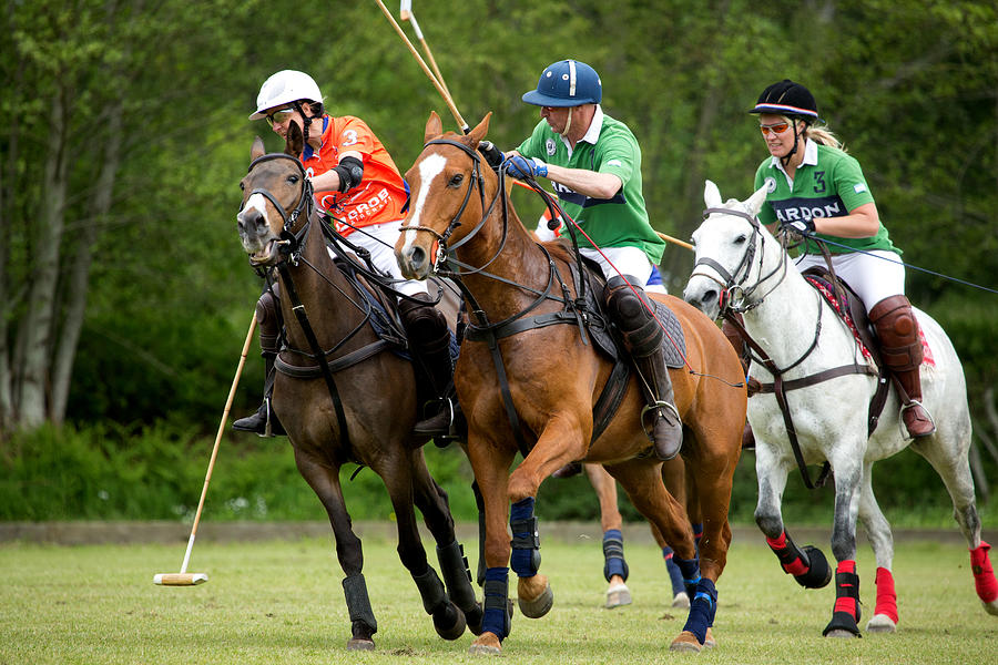 Two polo teams challenging for the ball #10 Photograph by Lorado