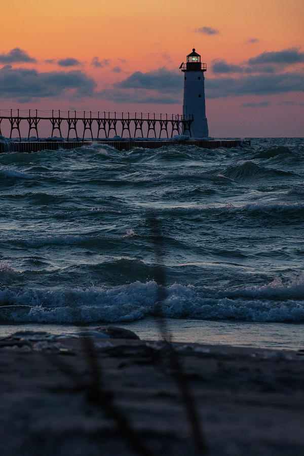 Sunset at Manistee Pier and Lighthouse in Manistee Michigan during the winter #11 Photograph by Eldon McGraw