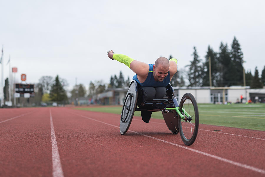 Adaptive athlete training on his racing wheelchair #12 Photograph by FatCamera