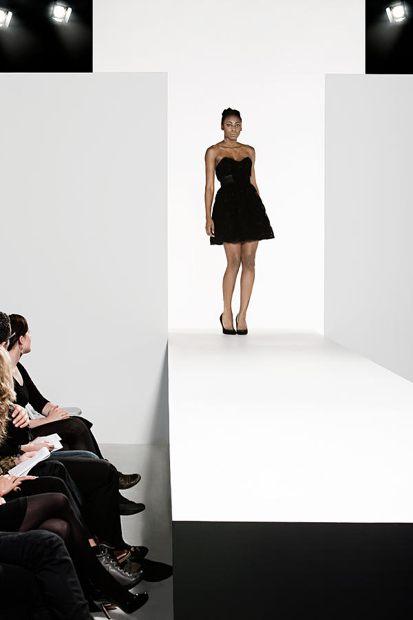 Model on catwalk at fashion show #12 Photograph by Image Source