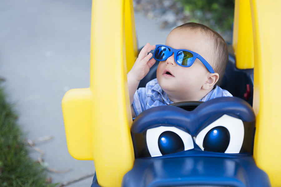 12 Month Old Baby Plays in Plastic Toy Car While Wearing Sunglasses Photograph by Jill Lehmann Photography