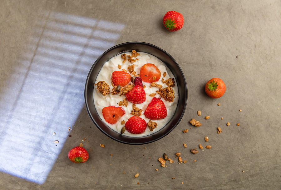 Sheep yoghurt topped with strawberries and granola. #12 Photograph by Annick Vanderschelden Photography