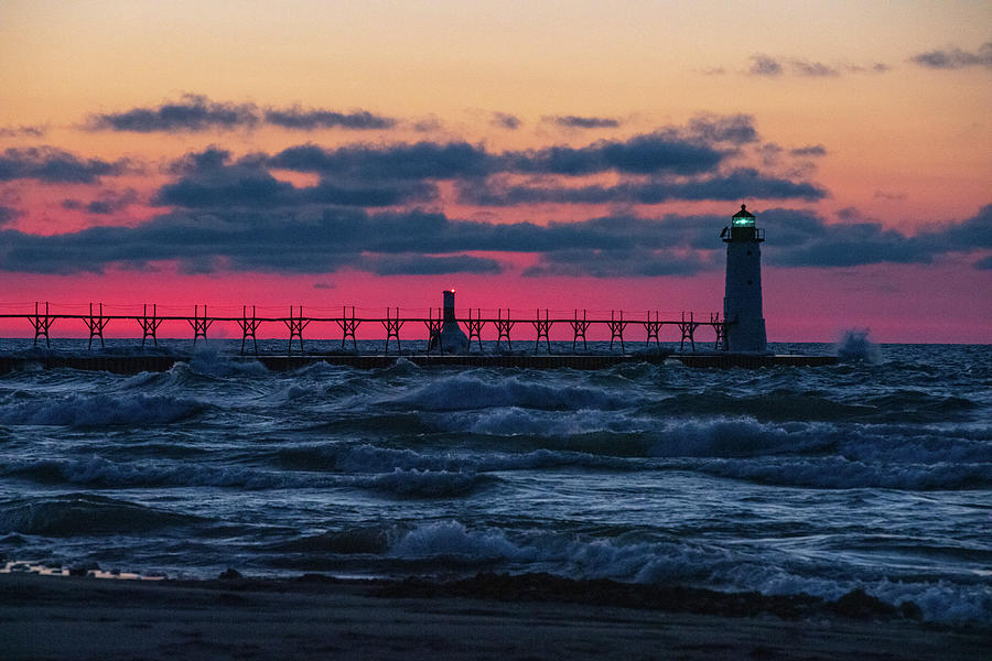 Sunset at Manistee Pier and Lighthouse in Manistee Michigan during the winter #13 Photograph by Eldon McGraw