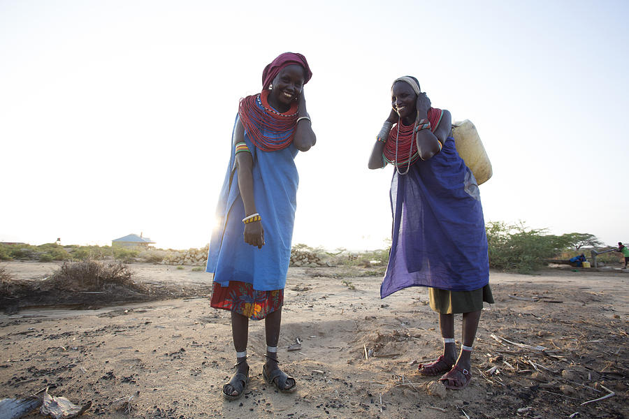 Women collecting clean water from borehole in desert. Samburu. Kenya. #13 Photograph by Hugh Sitton