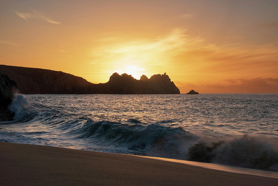 Majestic sunrise landscape at Porthcurno beach in Cornwall Engla ...