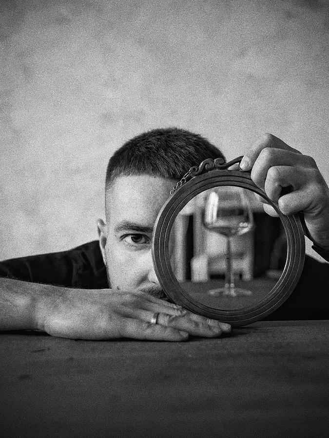 1493 Man Holding Round Mirror Photograph