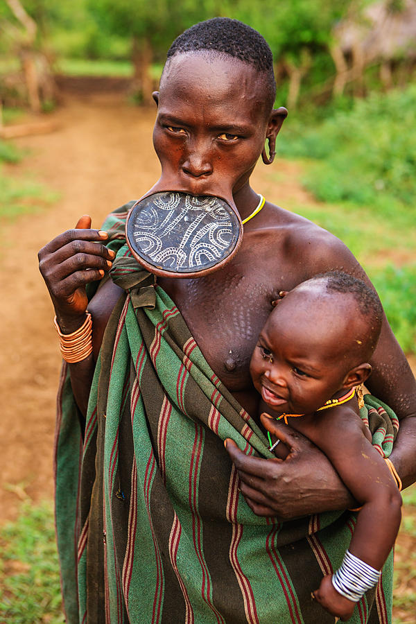 Portrait of woman from Mursi tribe, Ethiopia, Africa Photograph by Hadynyah