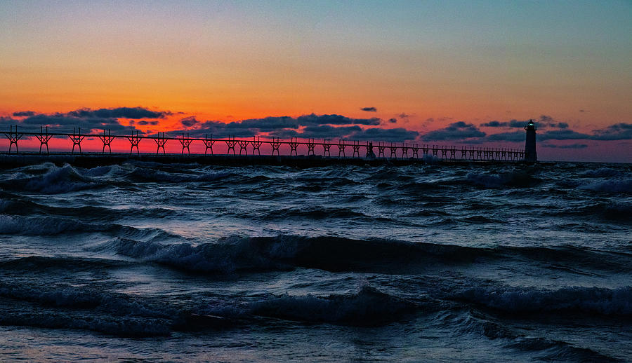 Sunset at Manistee Pier and Lighthouse in Manistee Michigan during the winter #15 Photograph by Eldon McGraw