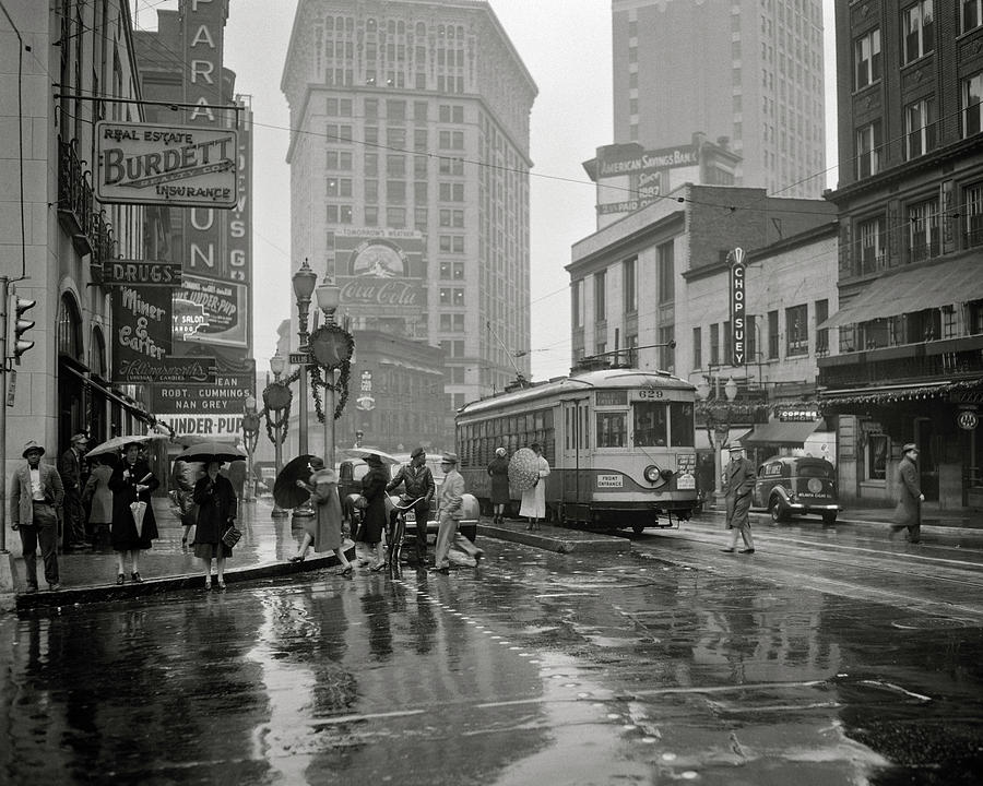 1930s 1940s Peachtree Street shops signs cars public trolley and pedestrians shoppers walking Photograph by Panoramic Images
