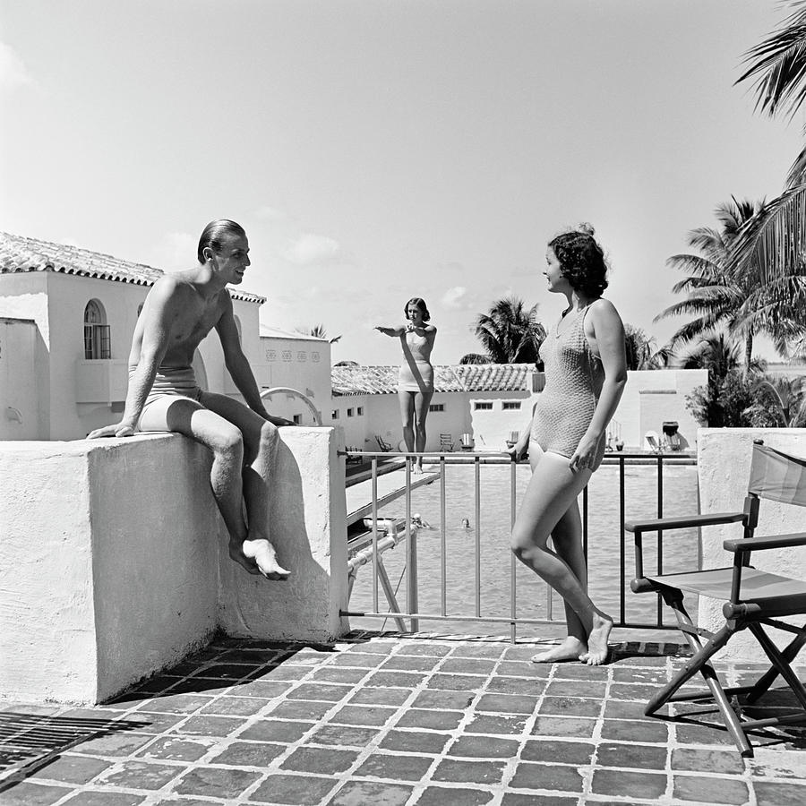 1930s Man Woman Wearing Bathing Suits On Terrace Overlooking Swimming Pool Woman On Diving Board Photograph by Panoramic Images 1930s Man Woman Wearing Bathing Suits On Terrace Overlooking Swimming Pool Woman On Diving Board Photograph by Panoramic Images