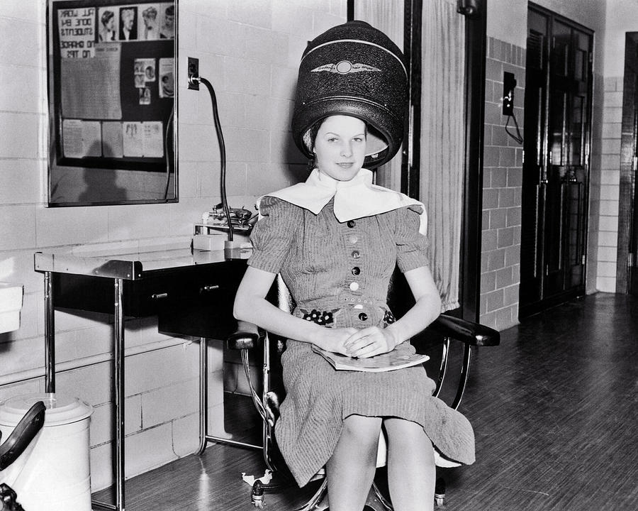 1930s Smiling Woman Looking At Camera Sitting Under Electric Hair Dryer In Professional Beautician Photograph by Panoramic Images