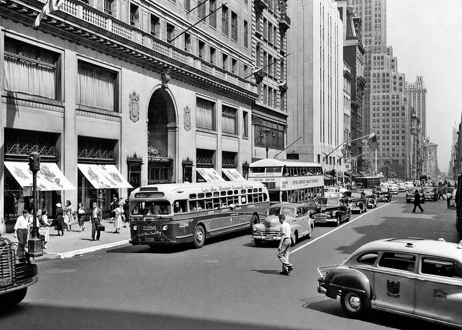1940s pedestrians buses cars cabs 5th Avenue traffic looking north Lord and Taylor department store  Photograph by Panoramic Images