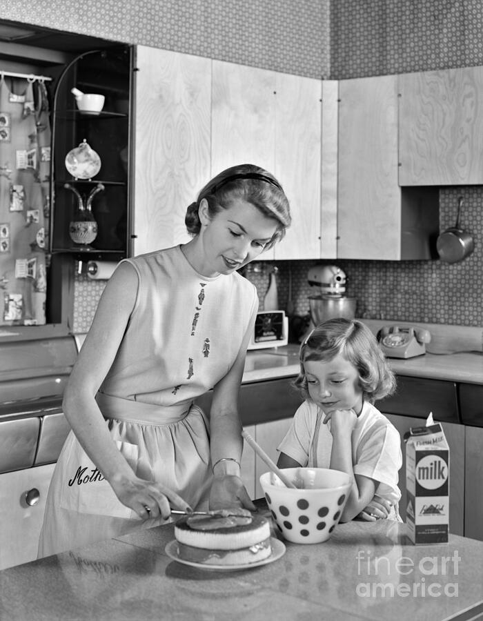 1950S Mother And Daughter In Kitchen Frosting... Photograph by Camerique