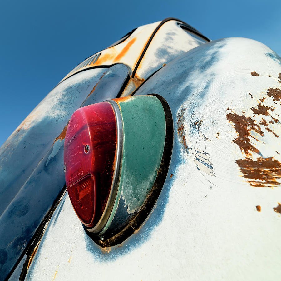 1967 Volkswagon Beetle Bug with rusty patina, wide angle low shot Photograph by Art Whitton