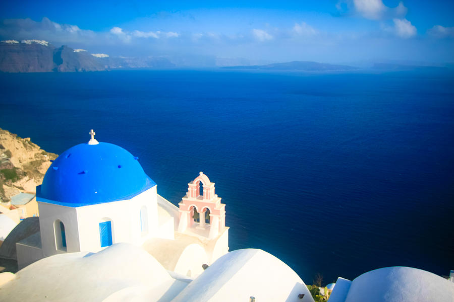 A blue and white church at Oia village look out to Aegean sea on Santorini island, Mediterranean, Greece #2 Photograph by Zcenerio