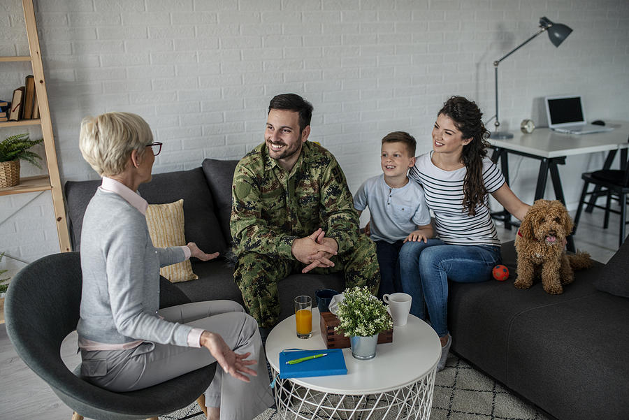 A Soldier And His Family At A Psychotherapist During A Session #2 Photograph by Martinns