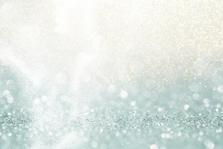 Abstract background made with illuminating glittering sparkles. New Year coming concept. Photograph by Anna Efetova