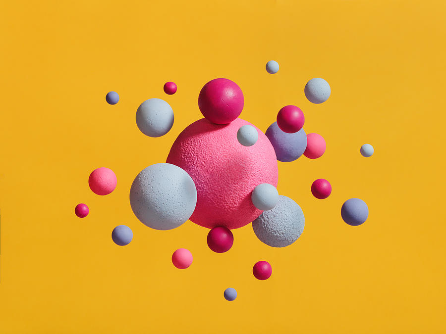 Abstract multi-colored spheres on yellow background #2 Photograph by Eugene Mymrin