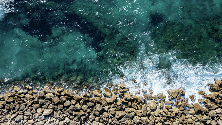 Aerial view from flying drone of crystal blue ocean water and sea wall. #2 Photograph by Michalakis Ppalis