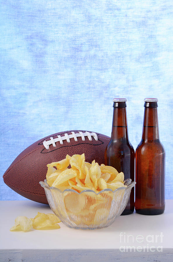 American football with beer and chips. #2 Photograph by Milleflore Images
