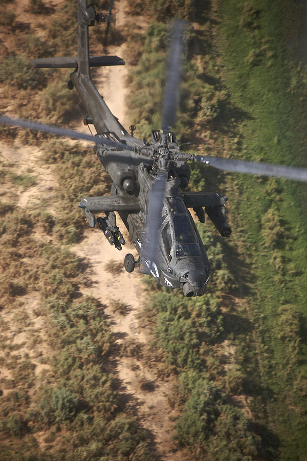 An AH-64D Apache Longbow helicopter in flight over Northern Iraq. #2 Photograph by Terry Moore/Stocktrek Images